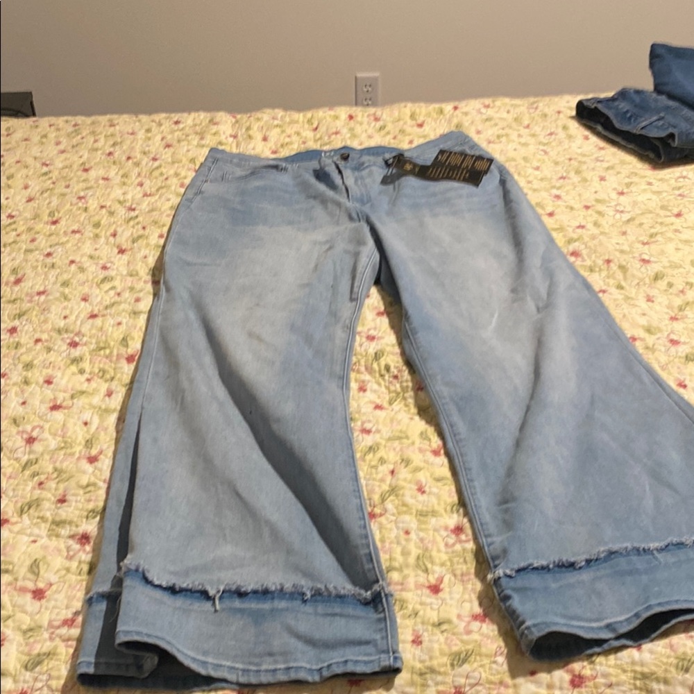 Brand new , light color jeans with trimmed cuff